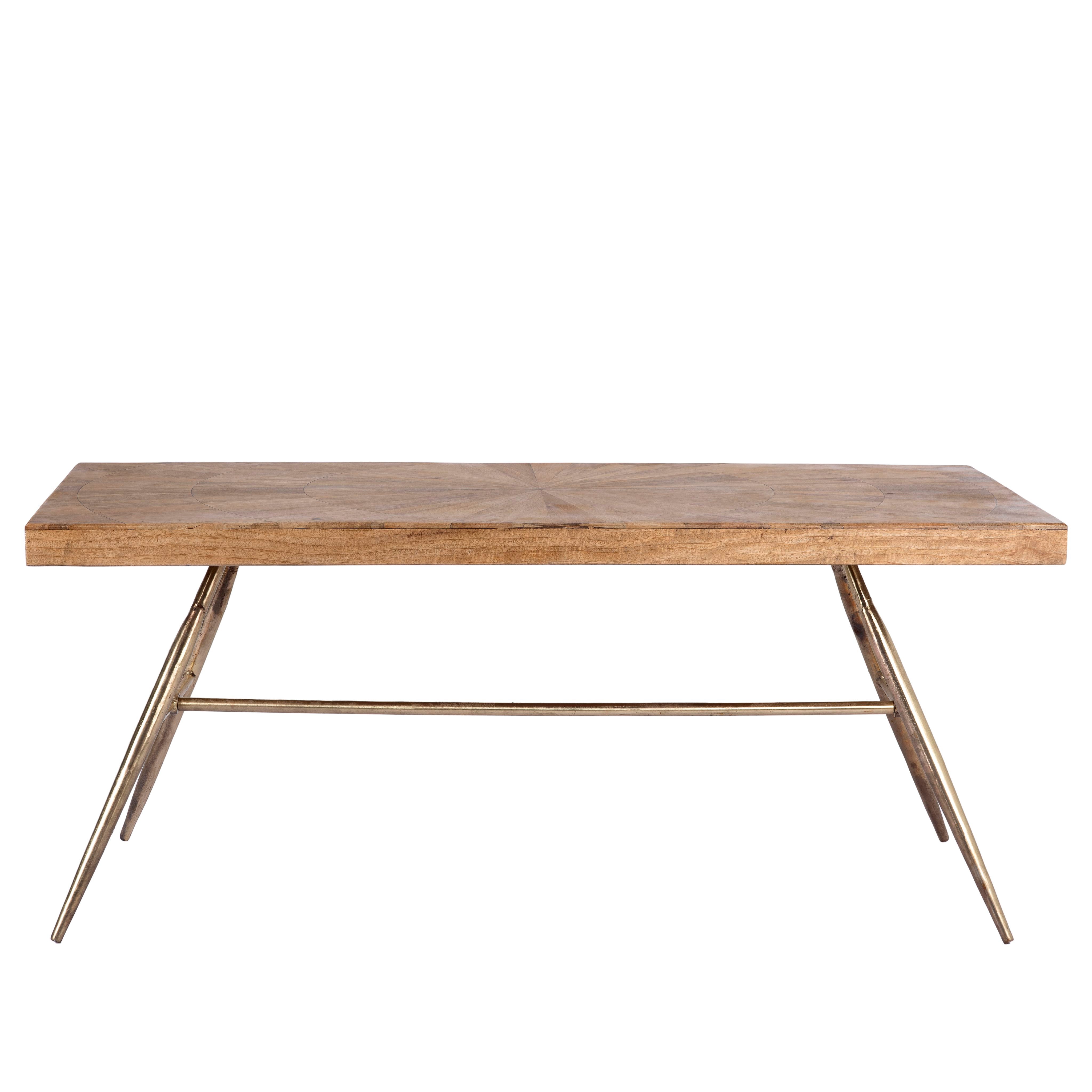 White background image of a Shankhin mango wood dining table featuring an intricately patterned natural wood tabletop with a brass-plated iron base and contemporary industrial design, 180cm.