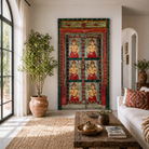 Lifestyle image of a decorative wall panel with figures in a room with a wicker chair and patterned rug.