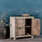Open door view view of a unique old Door cupboard finely hand carved in bleached teak wood, driftwood design with iron fittings.