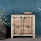 Front view of a unique old Door cupboard finely hand carved in bleached teak wood, driftwood design with iron fittings.