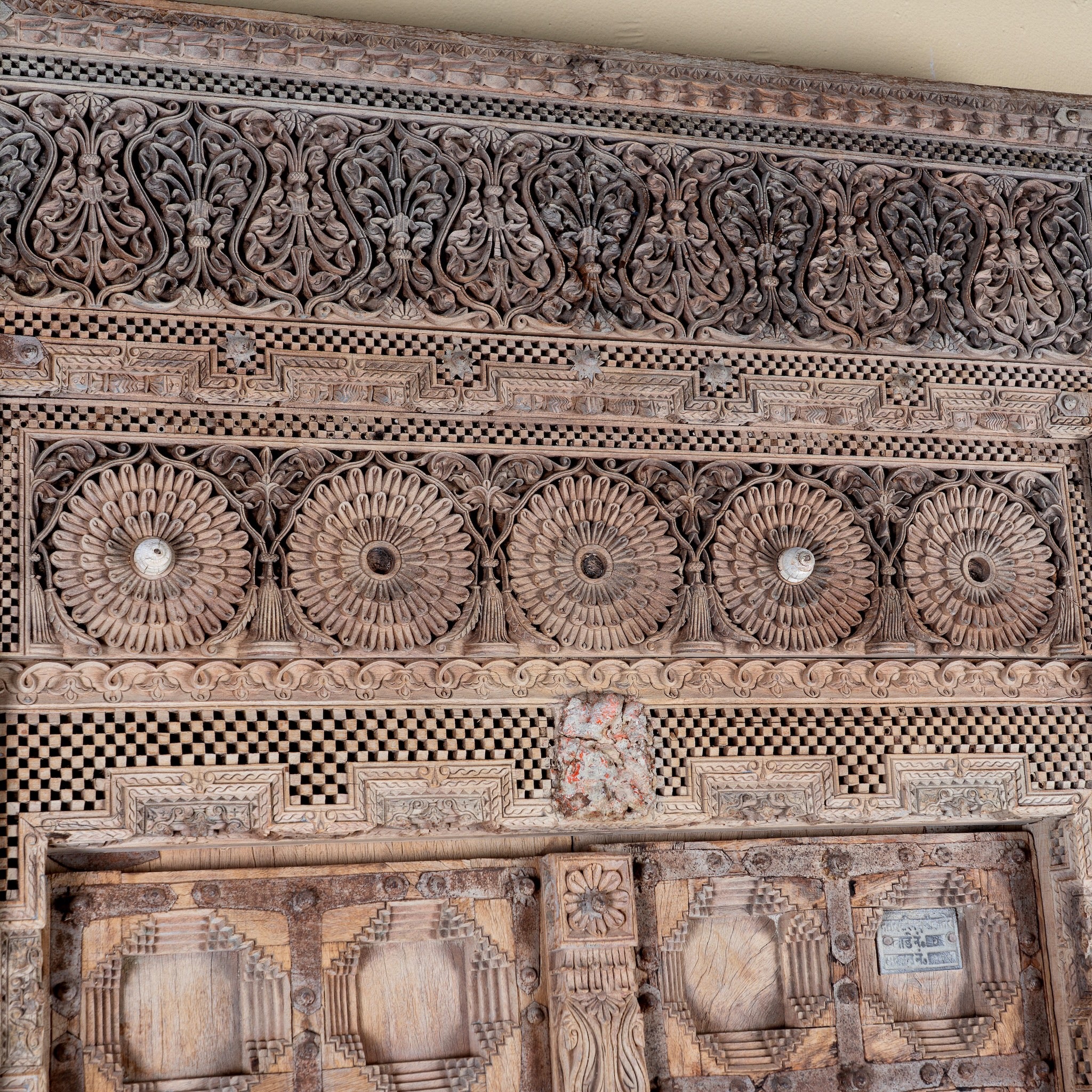 Close up image of a Shomil antique hand carved Indian teak wood door wall decoration 222cm