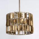 Large round brass-plated iron pendant lamp with ornate tile surface – vintage lighting and iron pendant light ideal for dining rooms or living spaces.