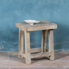 Small driftwood bench made of reclaimed wood with sandblasted finish; sustainable furniture, rustic design, 40 × 35 × 50 cm.