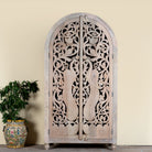 Hand-carved mango wood wardrobe with arched top and intricate peacock floral design – artisanal Indian bedroom furniture.