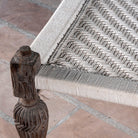 Close up of a handwoven Indian Charpai bed with reclaimed teak frame and carved legs; perfect for Indian home decor, 170 × 105 × 45 cm.