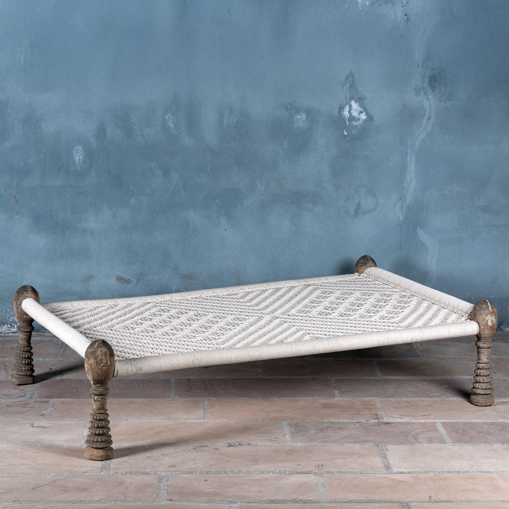 Handwoven Indian Charpai bed with reclaimed teak frame and carved legs; perfect for Indian home decor, 170 × 105 × 45 cm.