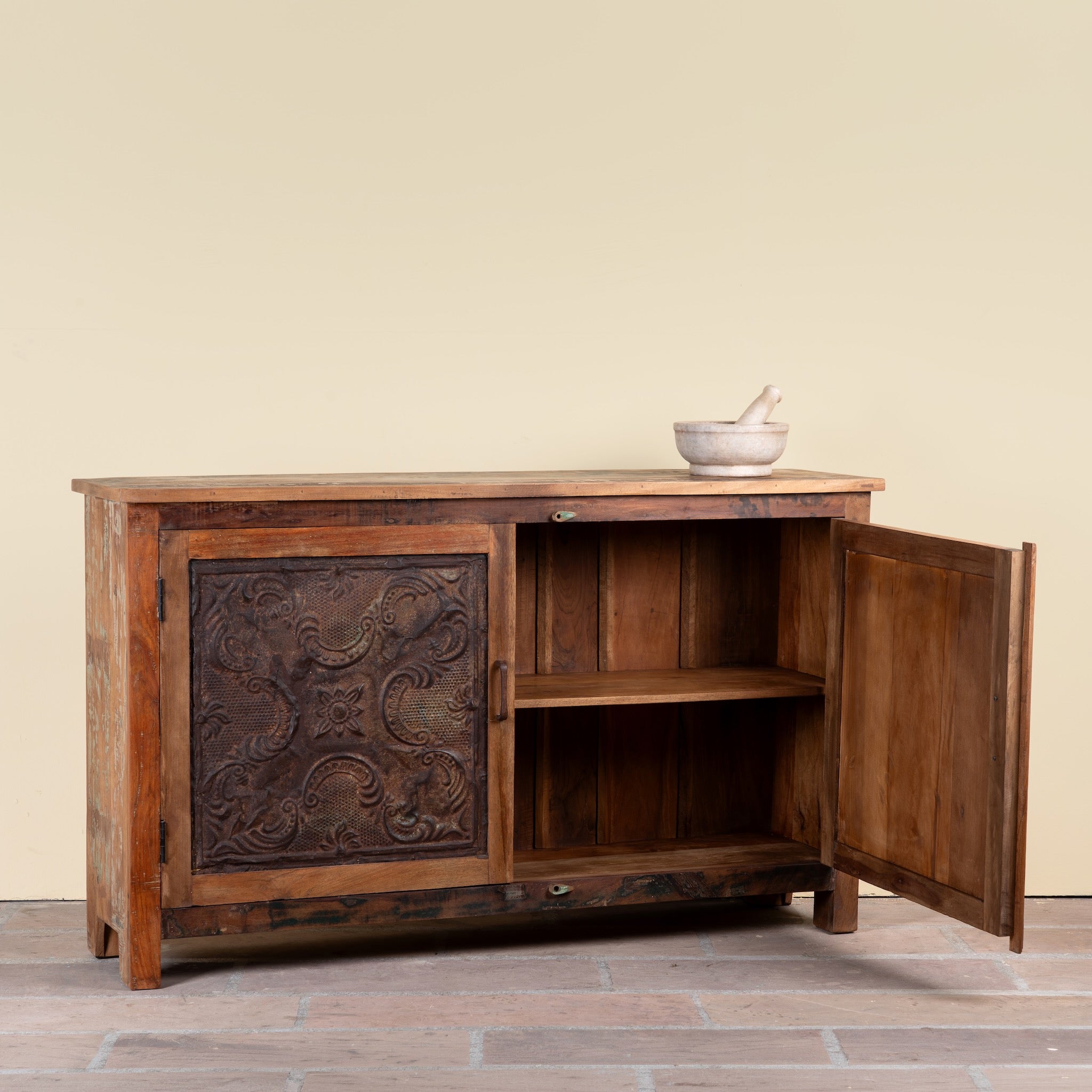 Side angle image with open door of a Sitara reclaimed wood sideboard with antique Indian iron ceiling panel doors 155cm