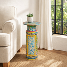 Lifestyle imagination of a hand‑painted wooden side table with floral motifs in vibrant colours, perfect for bohemian interiors and artisanal furniture displays.