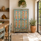 Lifestyle image of a Siyan hand painted reclaimed wood Boho cabinet with floral motifs 152cm