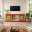 Lifestyle scene with a hand-painted reclaimed wood vintage lowboard with floral motifs – a colourful piece of sustainable furniture for artistic and rustic interiors.