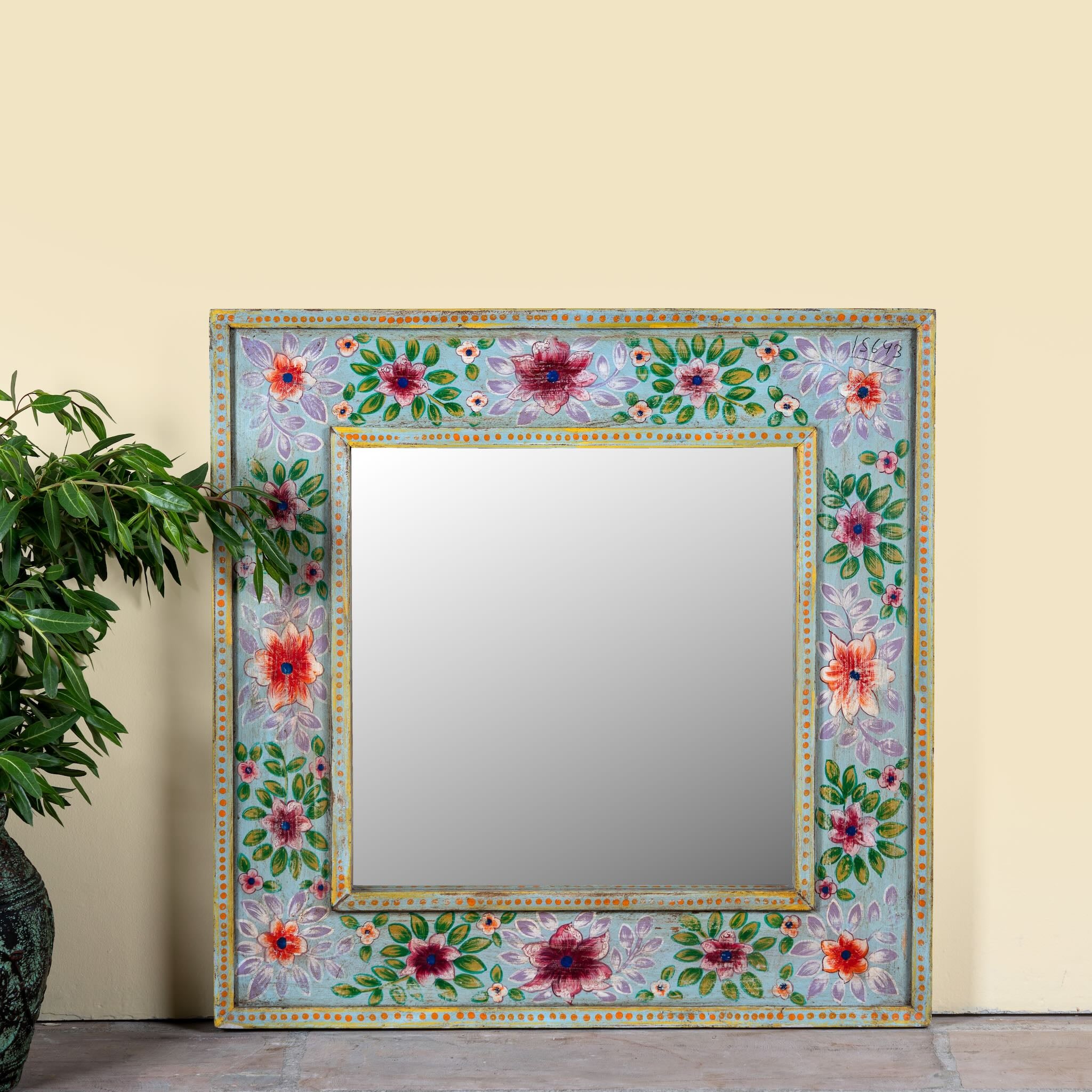 Snehal hand-painted reclaimed wood wall mirror featuring colourful floral artwork and artisan detailing, 90x90cm.