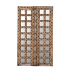 White background image of a wooden door mirror made from antique teak, part of our Indian home decor collection with original carvings and iron accents.