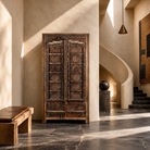Lifestyle image of a Srinika vintage Indian wardrobe with mango wood body and old hand-carved teak house door, 94x42x195cm