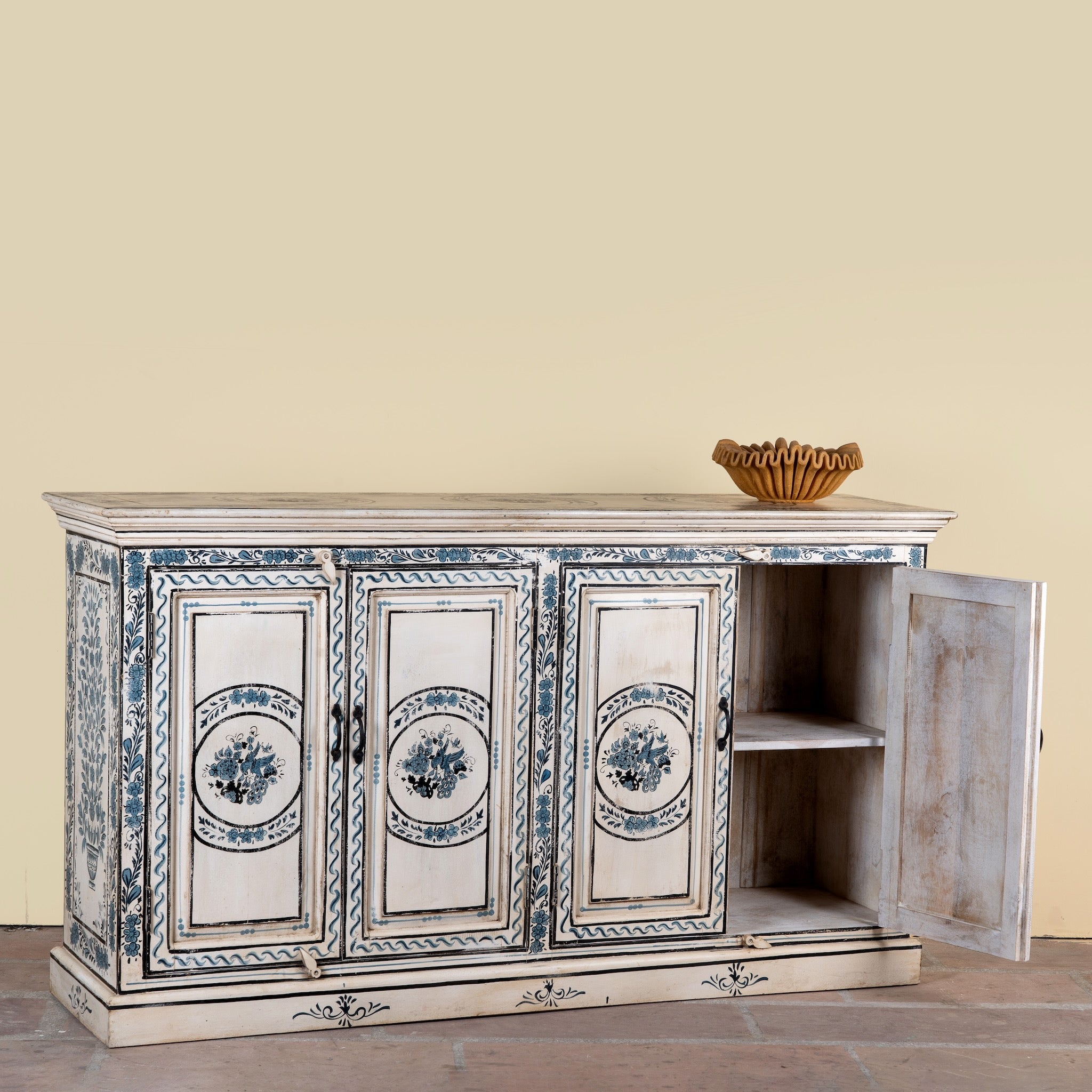 Side angle image with open door of a Suchi limited edition reclaimed wood sideboard with Delft inspired hand painted motifs 170cm