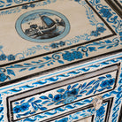 Close up image of a Suhasin limited edition reclaimed wood bedside table set with Delft inspired hand painted motifs