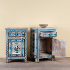 Side angle image with open door of a Suhasin limited edition reclaimed wood bedside table set with Delft inspired hand painted motifs