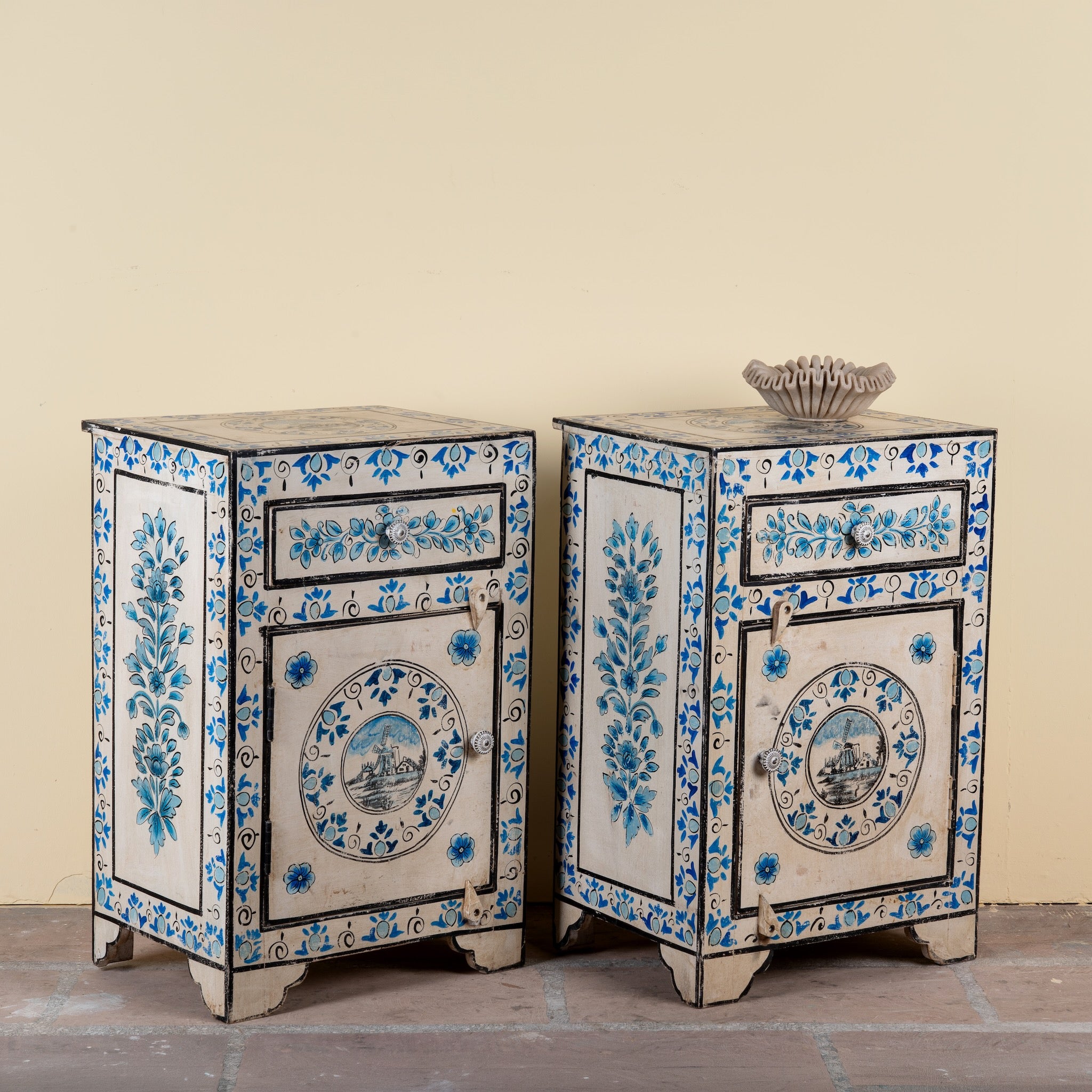 Side angle image of a Sunaina limited edition reclaimed wood bedside table set with Delft inspired hand painted motifs