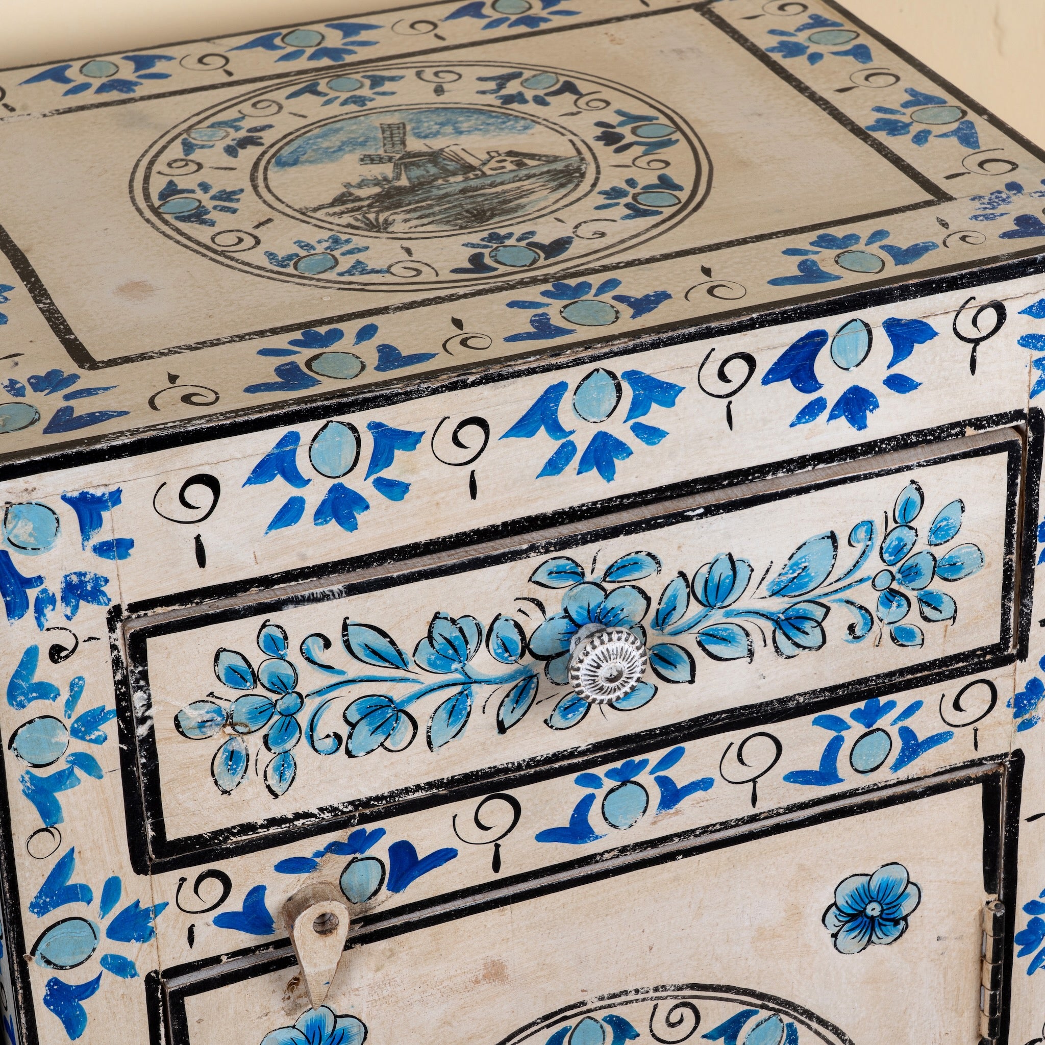 Close up image of a Sunaina limited edition reclaimed wood bedside table set with Delft inspired hand painted motifs
