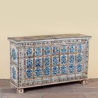 Side angle image of a Sur limited edition reclaimed wood storage chest with Delft inspired hand painted motifs
