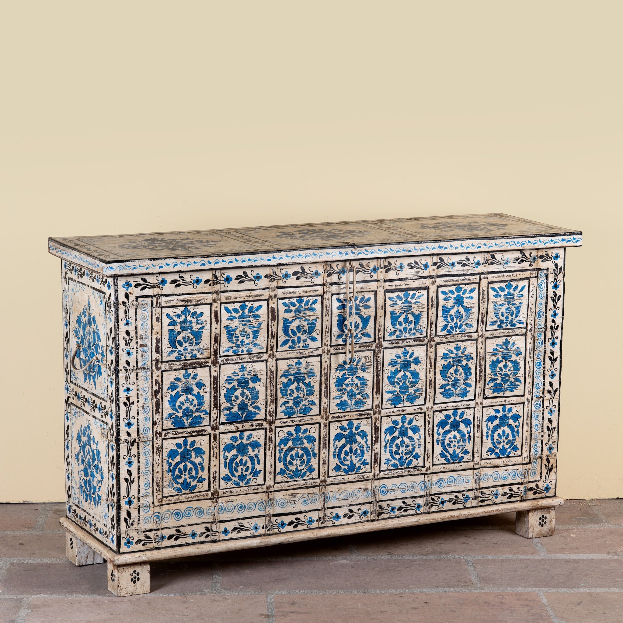 Side angle image of a Sur limited edition reclaimed wood storage chest with Delft inspired hand painted motifs