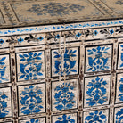 Close up image of a Sur limited edition reclaimed wood storage chest with Delft inspired hand painted motifs