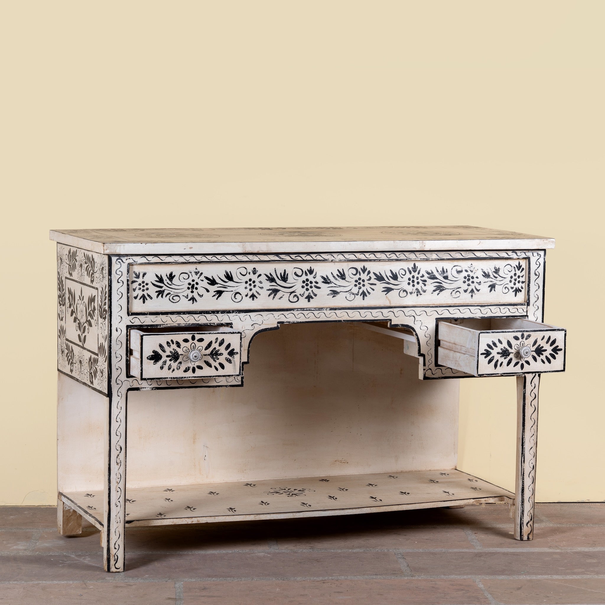 Side angle image with open drawer of a Swaha limited edition reclaimed wood desk with Delft inspired hand painted motifs