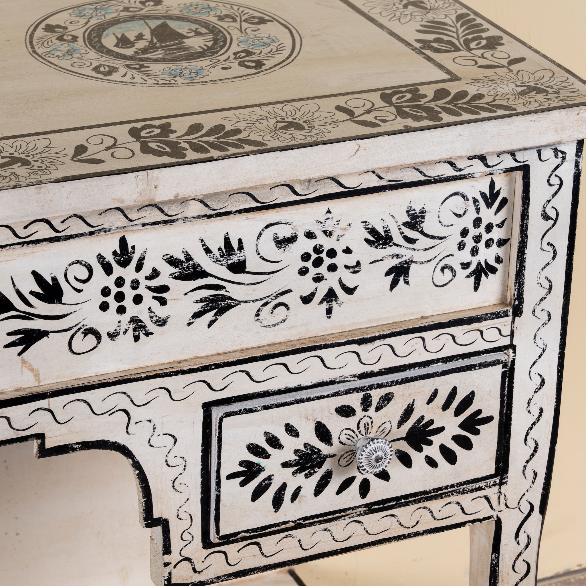 Close up image of a Swaha limited edition reclaimed wood desk with Delft inspired hand painted motifs