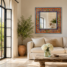 Lifestyle image of a Taksha hand-painted reclaimed wood wall mirror with colourful floral artwork, blue border detailing, and vintage artisan character, 90x90cm.