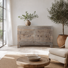 Lifestyle imagination o a handcrafted sideboard Tanay made from reclaimed teak wood, featuring antique Indian door fronts with original carvings. A Mediterranean-inspired piece of unique Indian furniture with sustainable character and functional storage.