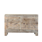 White background image of a handcrafted sideboard Tanay made from reclaimed teak wood, featuring antique Indian door fronts with original carvings. A Mediterranean-inspired piece of unique Indian furniture with sustainable character and functional storage.
