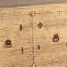 Close up image of a Tarini reclaimed teak wood sideboard with hand carved Orissa house door elements and original iron fittings 132cm