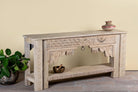 Side angle image of a reclaimed teak wood console using antique Indian house parts. Classic unique piece with shelf.