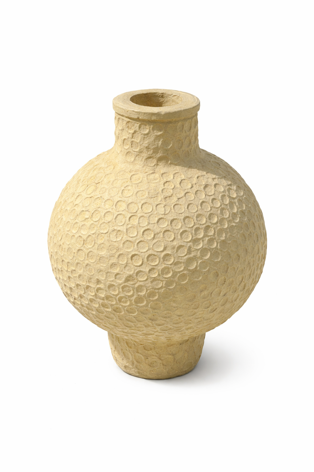 White background image of a andmade papier-mâché vase Jishaa with round body and circular embossed pattern. A vintage home accessory and unique Indian decoration perfect for dried flowers or as a sculptural vintage home decor piece.