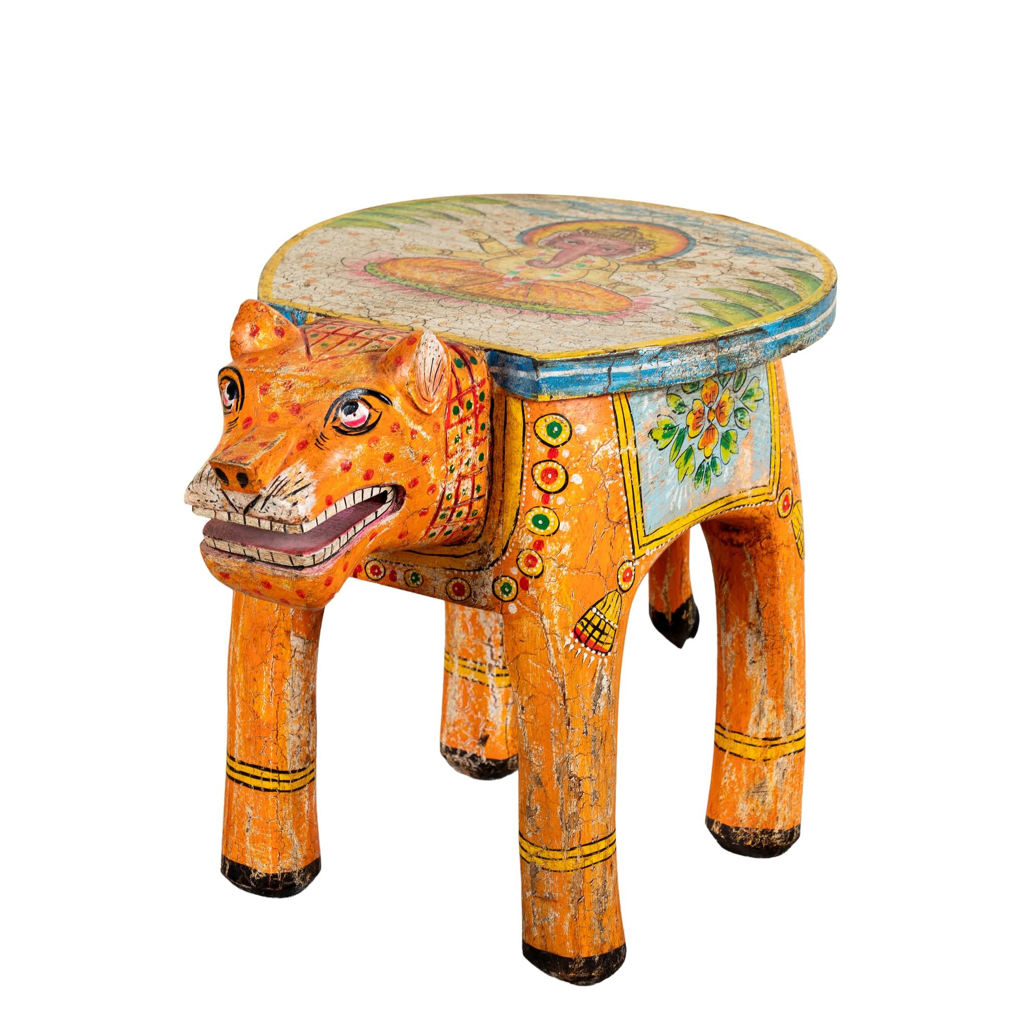 White background image of a hand-painted wooden tiger side table featuring Indian folk art and floral details, shaped like a tiger with deity painting on top, perfect for vintage and India-inspired home accessories.