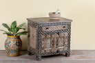 Side angle image of a hand painted bedside cabinet made of reclaimed wood with one drawer and two doors in Sanskrit style.