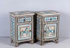 Side angle picture of a set of two hand painted night stands with floral and horse motifs; sustainable furniture made of reclaimed wood, 45 × 35 × 70 cm.