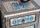 Close up image of a set of two hand painted night stands with floral and horse motifs; sustainable furniture made of reclaimed wood, 45 × 35 × 70 cm.