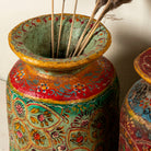 Close up image of a hand-painted papier-mâché vase Udanth in mixed colours with floral and folk motifs. A vintage home accessory and unique Indian decoration ideal for vintage home decor or use as a decorative statement vase.