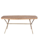 White background image of a Uddanda mango wood dining table featuring an intricately patterned natural wood tabletop with a brass-plated iron base and contemporary industrial design, 181cm.