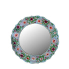 White background image of a Ujjwal hand-painted round reclaimed wood mirror with colourful floral artwork, turquoise vintage frame, and artisan detailing, 90cm diameter.