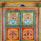 Close up image of a hand-painted teak wood cabinet with floral motifs; teak wood furniture for bohemian interiors, 105 × 55 × 177 cm.