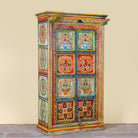Side angle image of a hand-painted teak wood cabinet with floral motifs; teak wood furniture for bohemian interiors, 105 × 55 × 177 cm.