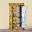 Open door image of a hand painted wardrobe made of teak wood with floral motifs; unique furniture inspired by Indian artistry, 104 × 50 × 186 cm.