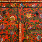 Close up image of a of a hand painted sideboard made of reclaimed wood in boho design with ample storage.