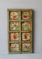 Vedant hand-painted teak wood wall decoration featuring eight illustrated folklore panels, an expressive and detailed wall decoration from antique Indian door panels.