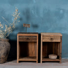 Front view image of a reclaimed wood bedside table with drawer and open shelf – handcrafted driftwood furniture designed for rustic minimalism and natural interiors.
