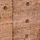 Close up image of a Viara carved reclaimed wood sideboard with drawers, bleached finish and original hand-carved Indian teak house elements, 160x45x90cm