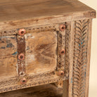 Close up image of a Vihanraj reclaimed teak wood console table with original Indian door front, iron fittings and lower storage shelf 178cm
