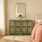Lifestyle image of a reclaimed wood sideboard with hand painted floral motifs and distressed finish; artisanal storage furniture for bohemian interiors, 170 × 40 × 104 cm.