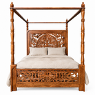 White background image of a Vishika hand carved mango wood four poster bed with teak finish, ornate floral carved headboard and footboard, for 180x200cm mattress.